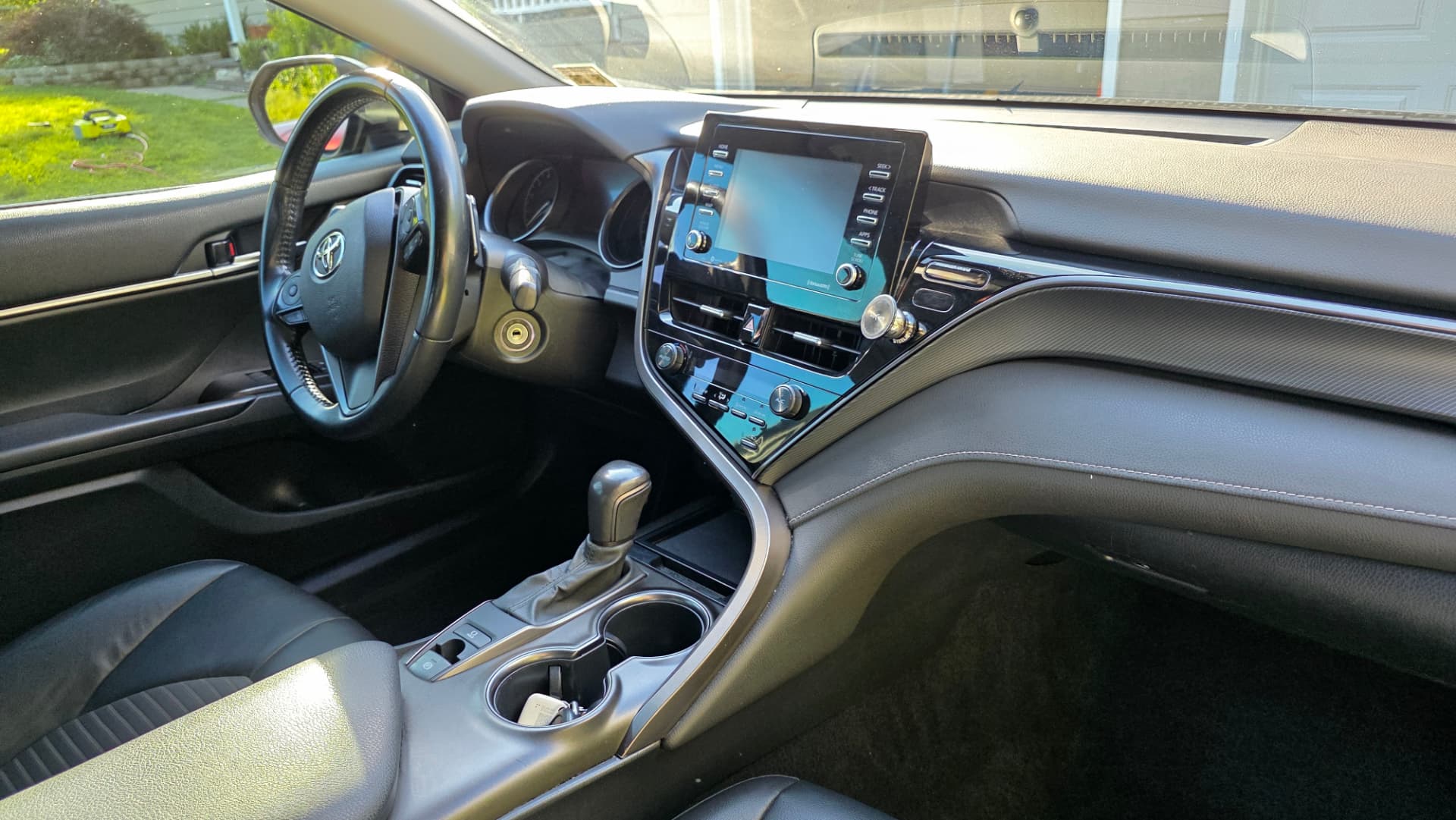 Freshly detailed Toyota Camry interior with clean dashboard and console
